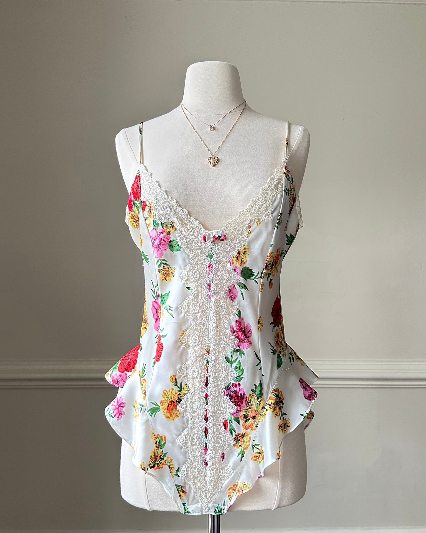 Victoria’s Secret’s Feminine Satin Bodysuit featuring Vibrant Floral Prints