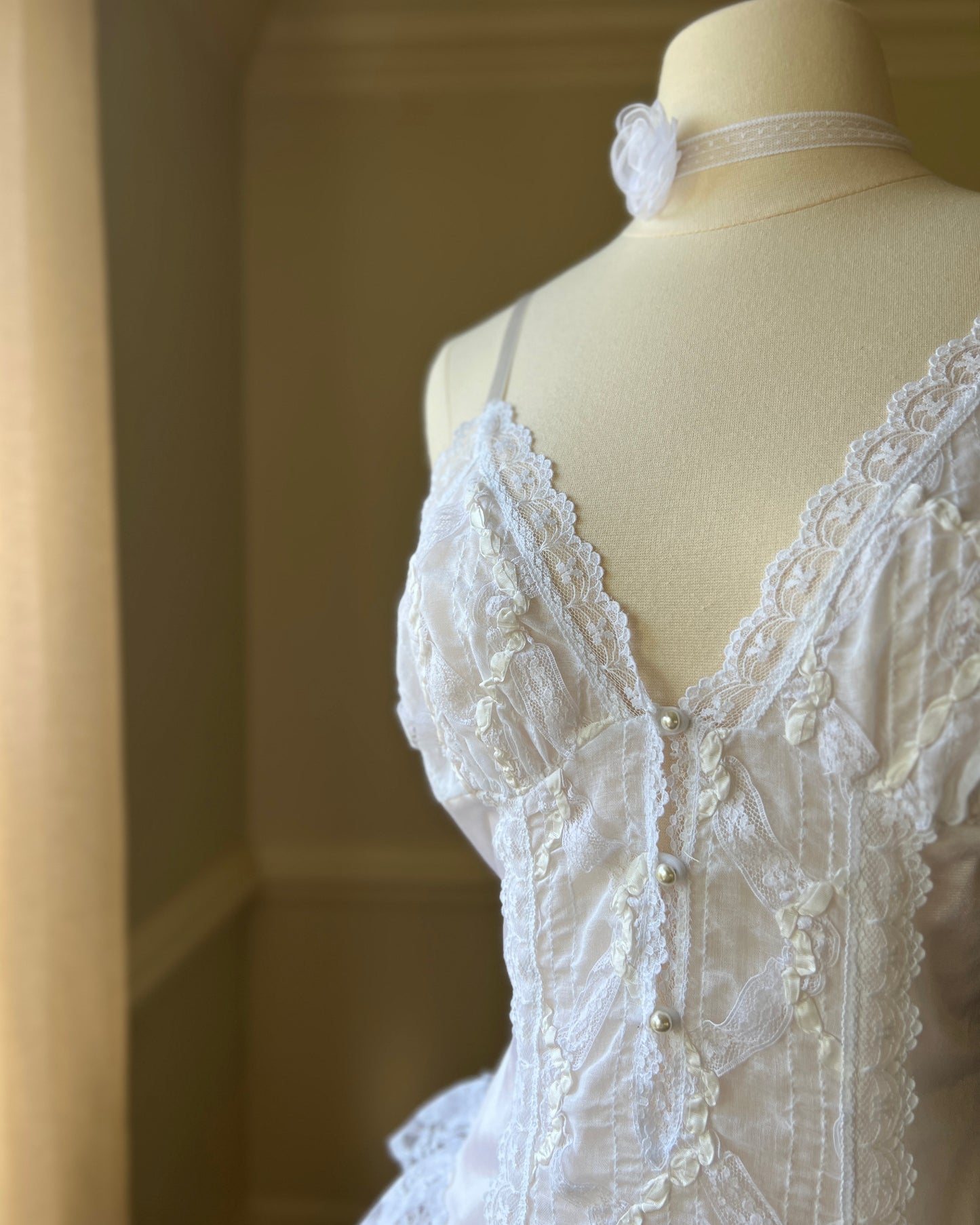 Angelic Laced Bodysuit featuring satin Lace Crisscross Detail with Ruffled Skirt Fringe