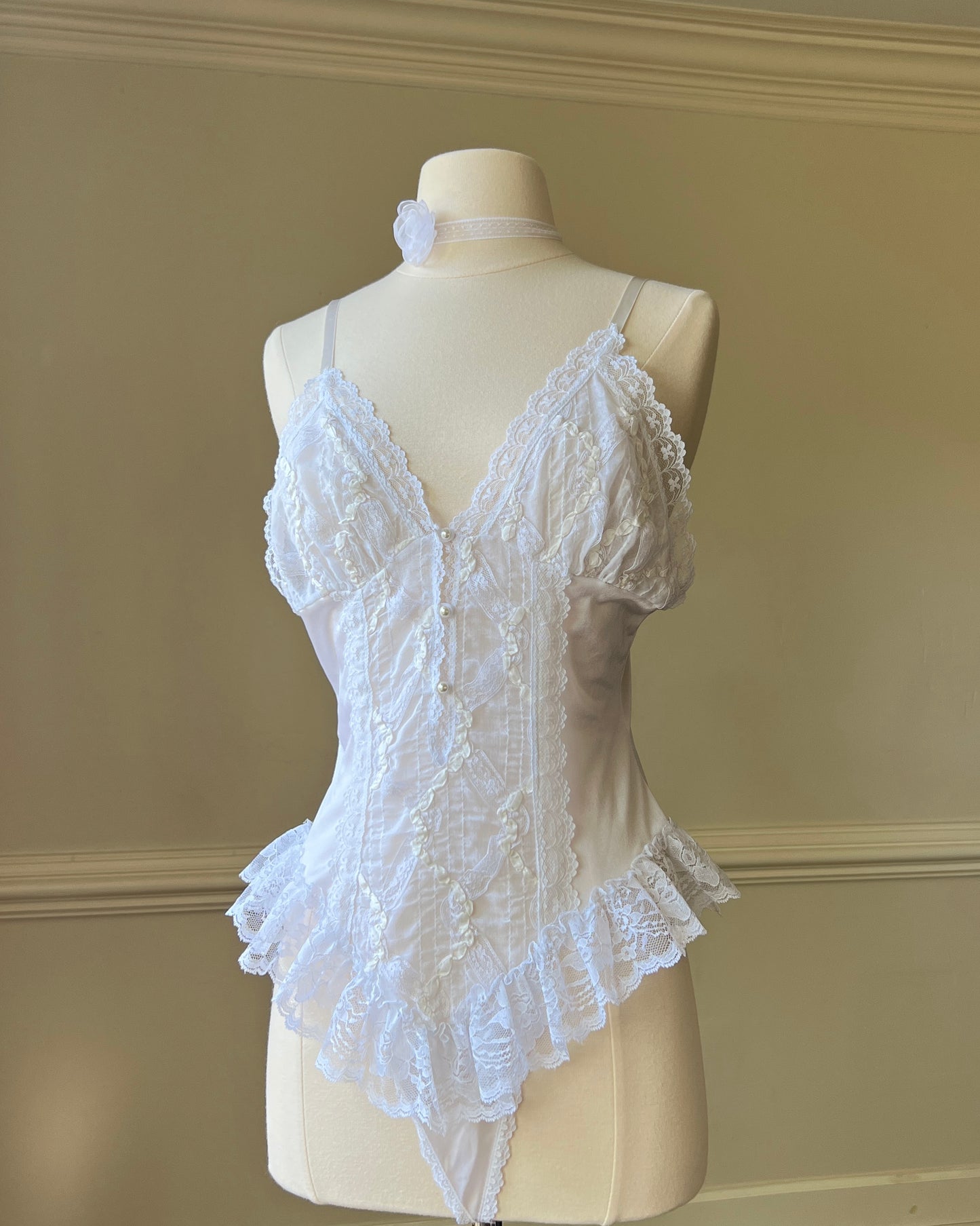 Angelic Laced Bodysuit featuring satin Lace Crisscross Detail with Ruffled Skirt Fringe