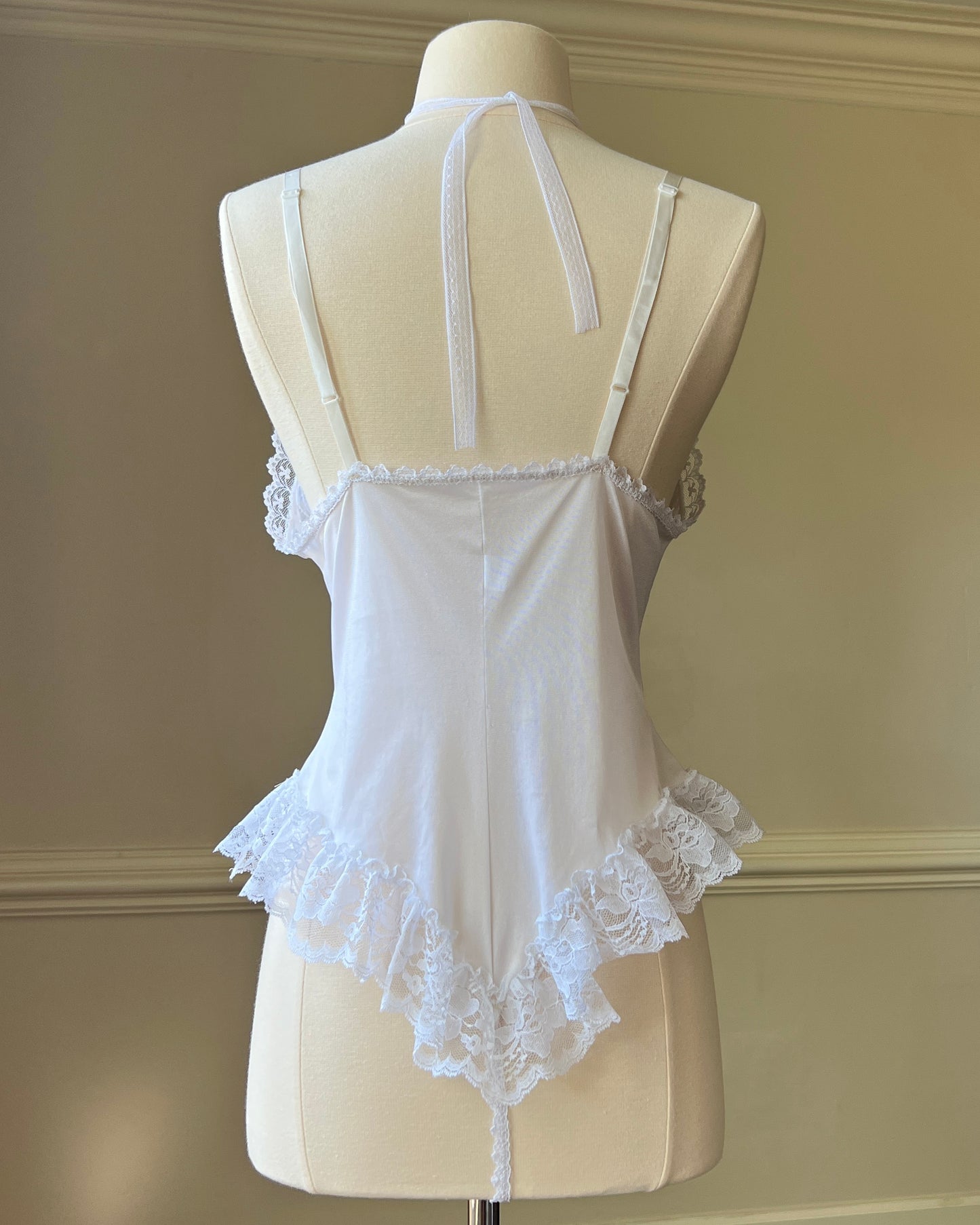 Angelic Laced Bodysuit featuring satin Lace Crisscross Detail with Ruffled Skirt Fringe