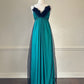 Emerald green maxi dress featuring sheer black mesh layout