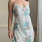 Vintage satin slip dress in white featuring bouquets of roses print