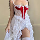 Frederick’s stunning bridal-inspired sheer slip dress featuring crimson red velvet bustier patch detail