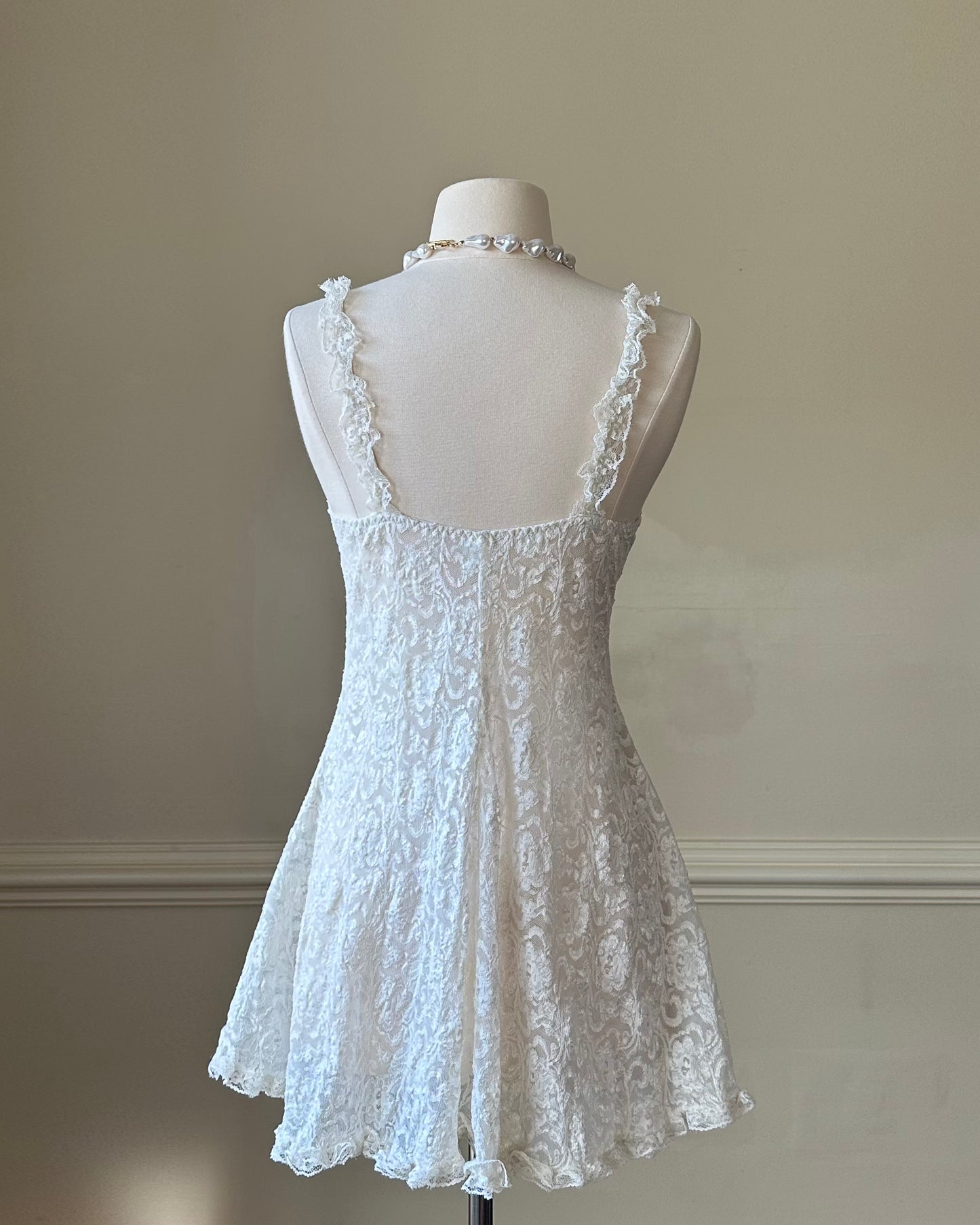 Vintage ivory lace slip dress with a romantic allover floral pattern