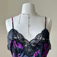 Vintage DIOR’s satin black bodysuit featuring vibrant purple floral prints