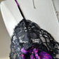 Vintage DIOR’s satin black bodysuit featuring vibrant purple floral prints