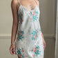 Vintage satin slip dress in white featuring bouquets of roses print