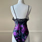 Vintage DIOR’s satin black bodysuit featuring vibrant purple floral prints