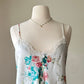 Vintage satin slip dress in white featuring bouquets of roses print
