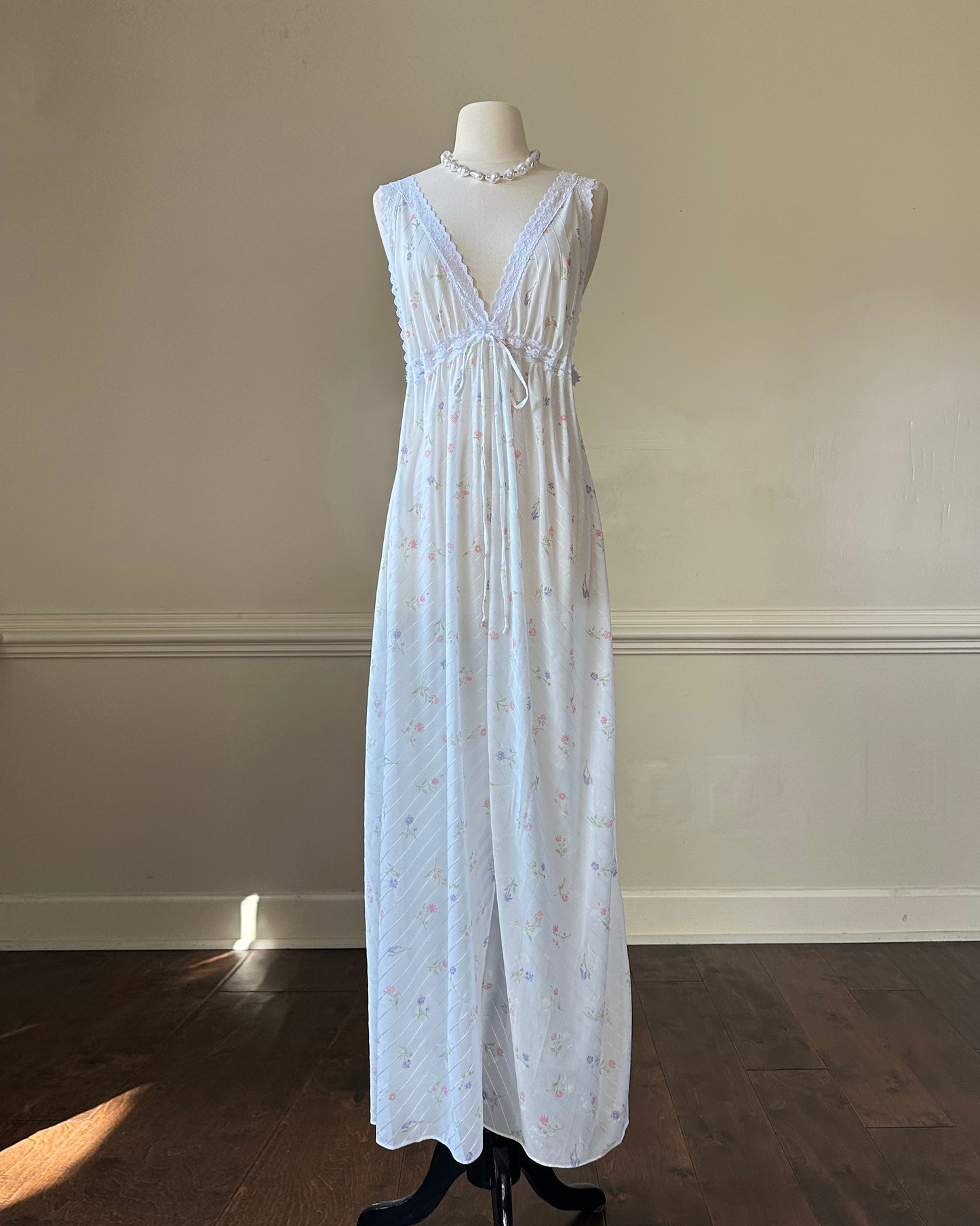 Vintage white maxi nightgown with pastel floral print and subtle satin stripe texture