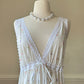 Vintage white maxi nightgown with pastel floral print and subtle satin stripe texture