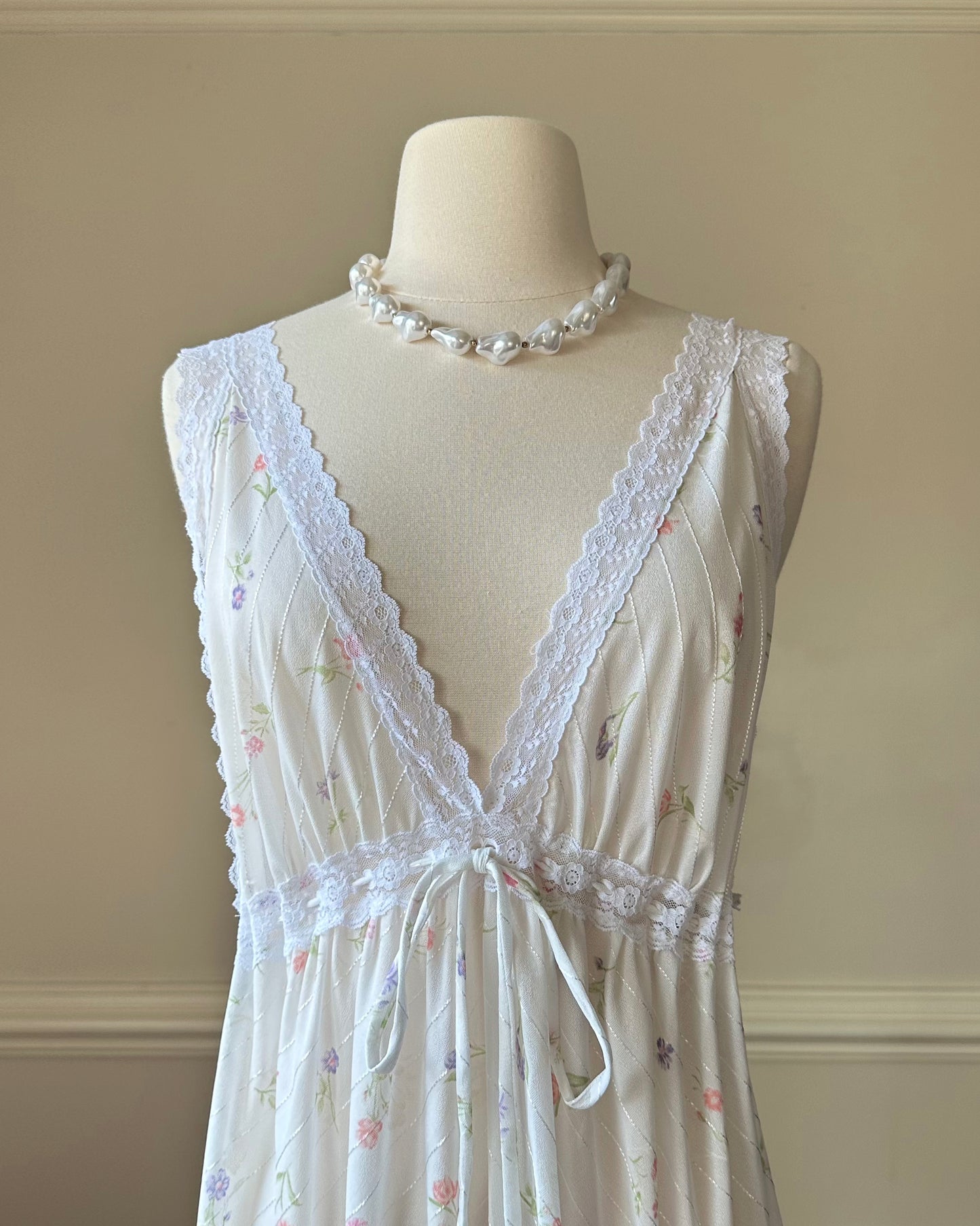 Vintage white maxi nightgown with pastel floral print and subtle satin stripe texture