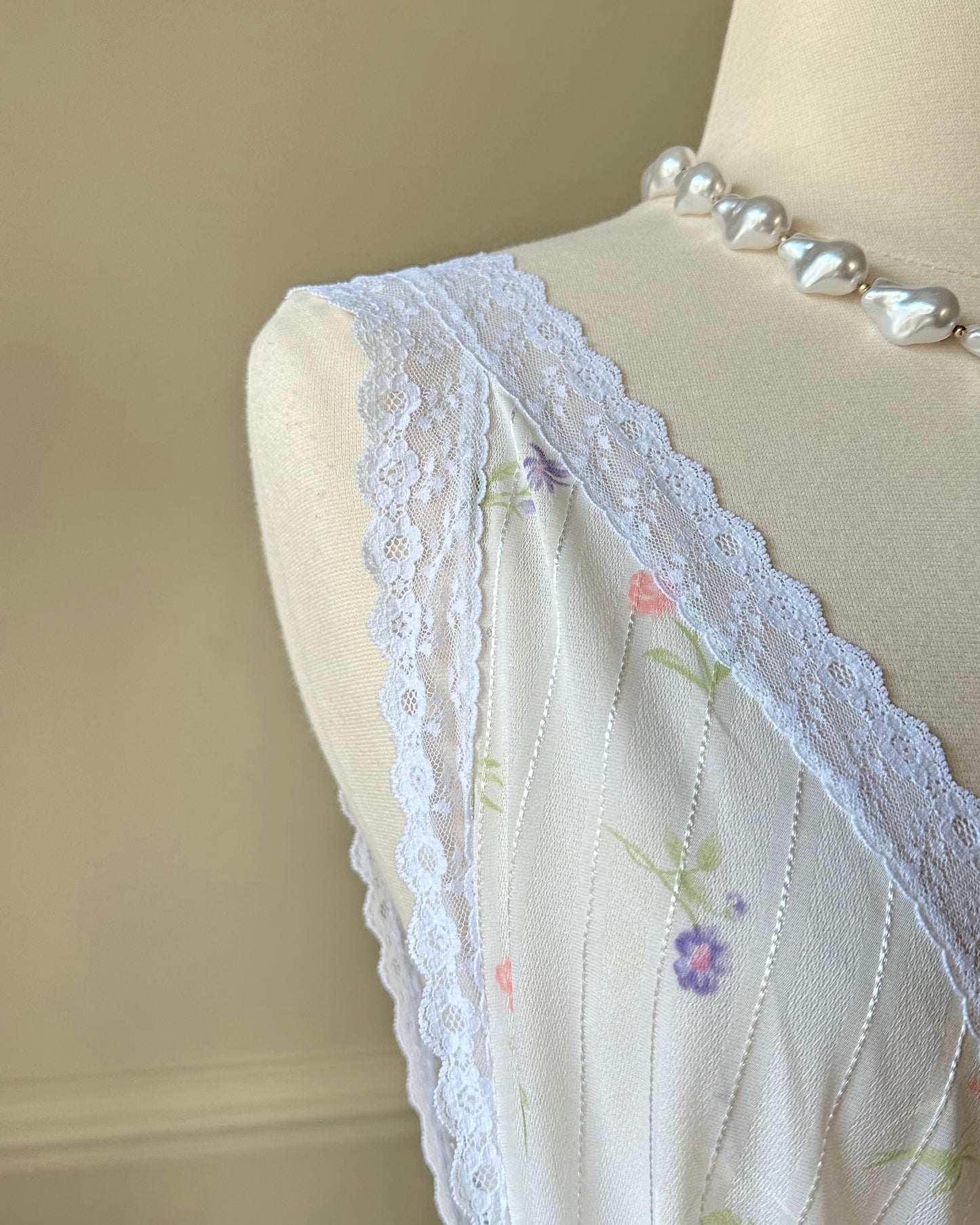 Vintage white maxi nightgown with pastel floral print and subtle satin stripe texture