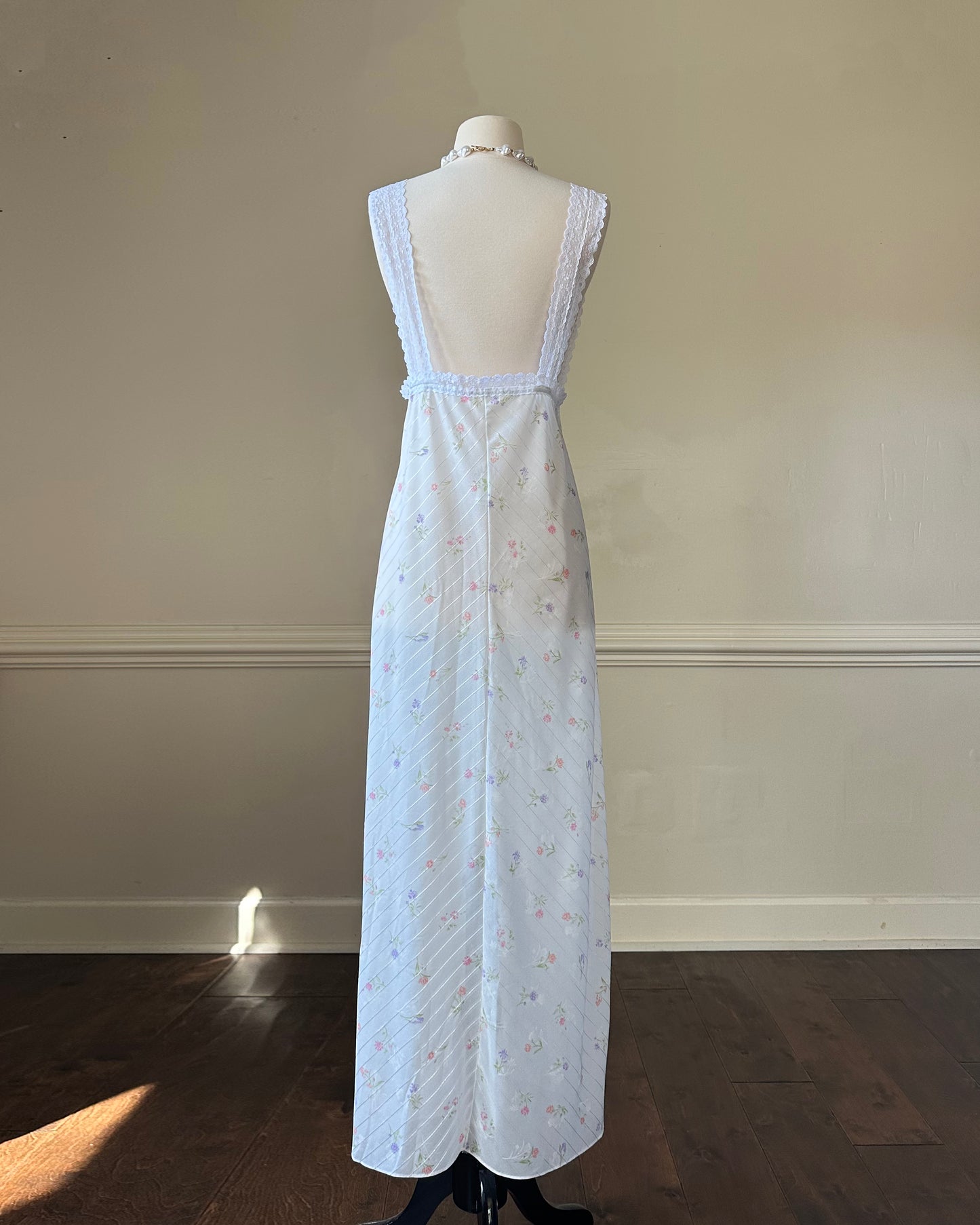 Vintage white maxi nightgown with pastel floral print and subtle satin stripe texture