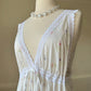 Vintage white maxi nightgown with pastel floral print and subtle satin stripe texture