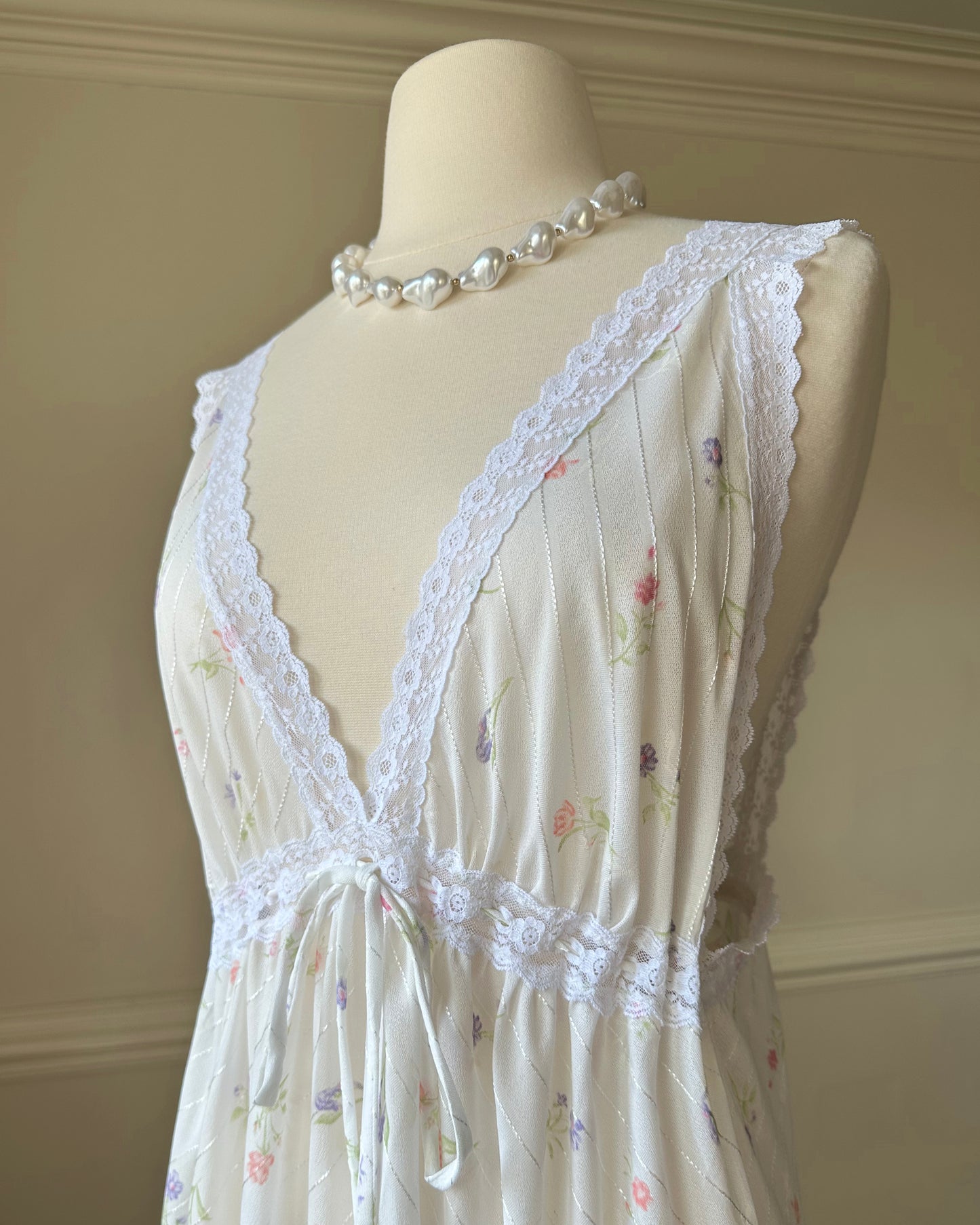 Vintage white maxi nightgown with pastel floral print and subtle satin stripe texture