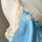 Ethereal sky blue satin maxi dress featuring rosettes embroidery bust