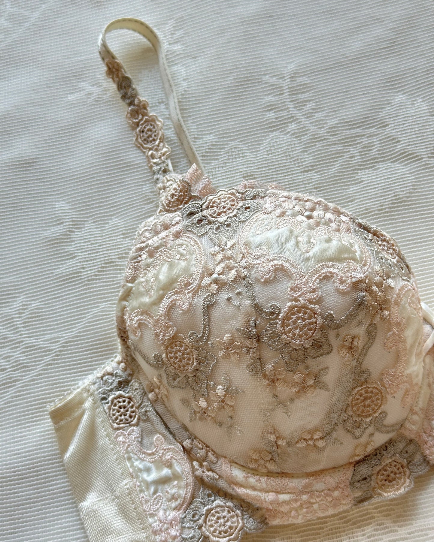 Vintage cream Japanese brassiere featuring neutral intricate embroidered