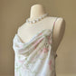 Vintage floral slip dress featuring a soft cowl neckline