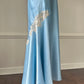 Ethereal sky blue satin maxi dress featuring rosettes embroidery bust