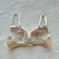 Vintage cream Japanese brassiere featuring neutral intricate embroidered