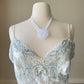 Vintage Victoria’s Secret ivory satin mini slip with blue lace