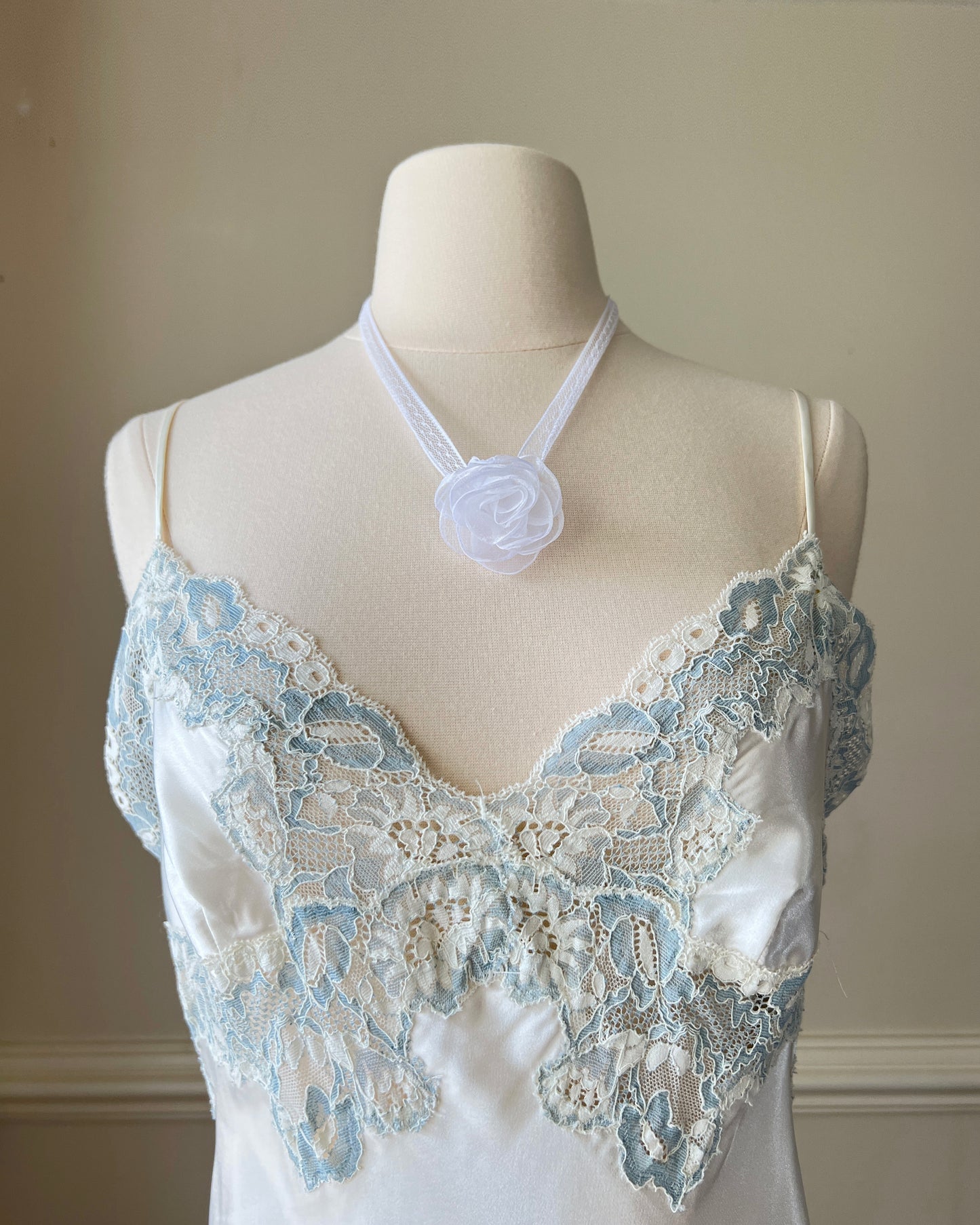 Vintage Victoria’s Secret ivory satin mini slip with blue lace