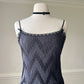 Teddy Romper in Satin Black featuring Geometric Pleating Patterns Laced Lining