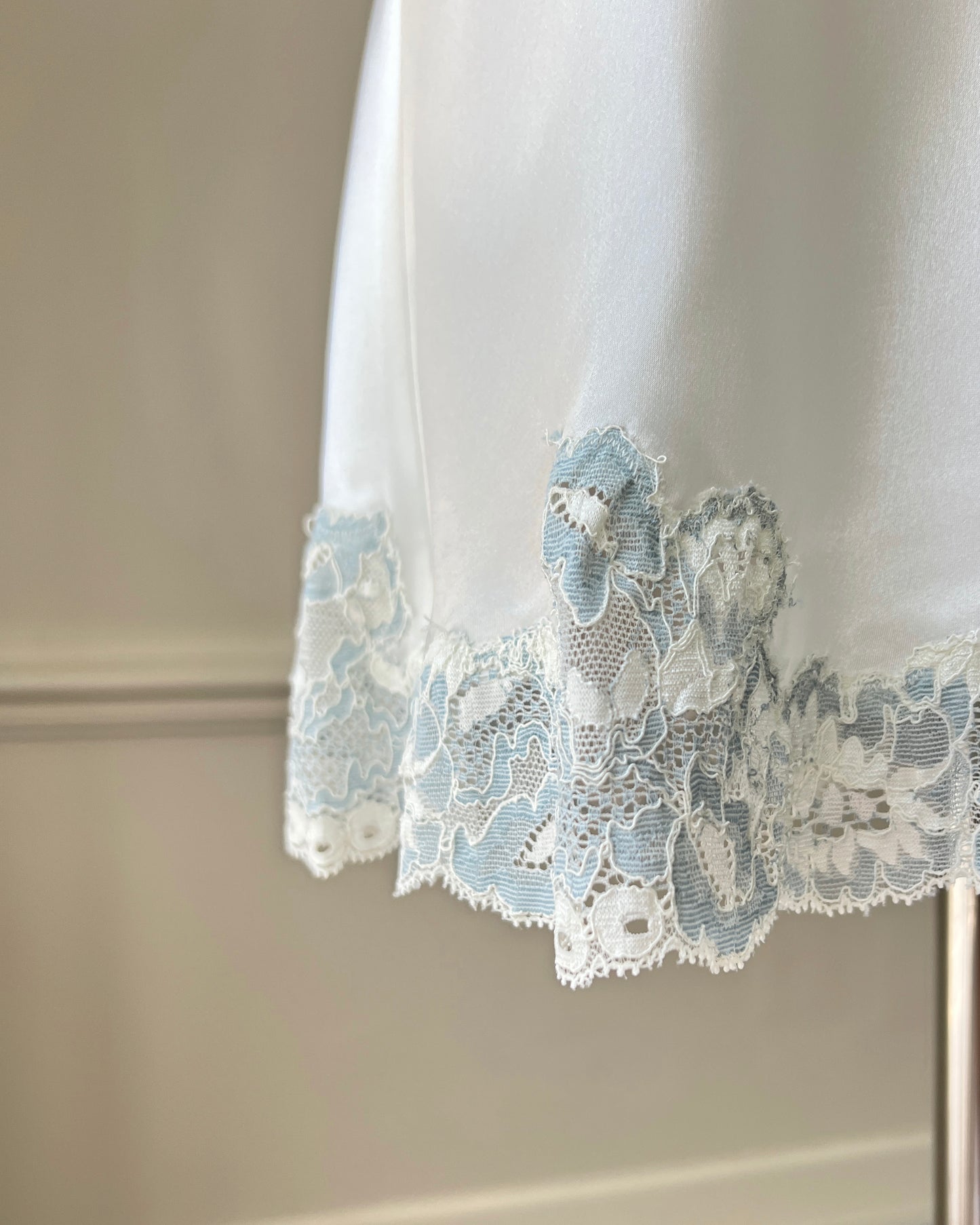 Vintage Victoria’s Secret ivory satin mini slip with blue lace