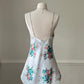 Vintage satin slip dress in white featuring bouquets of roses print