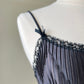 Teddy Romper in Satin Black featuring Geometric Pleating Patterns Laced Lining