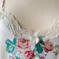 Vintage satin slip dress in white featuring bouquets of roses print